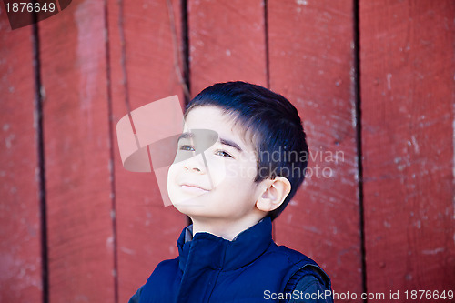 Image of Little Boy Joyfully Gazing Up at the Sky