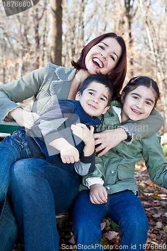 Image of Laughing Mother Hugging Her Children