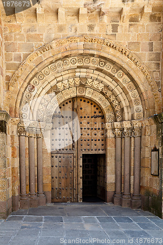 Image of Open Old Church Door with Stone Arches and Columns 