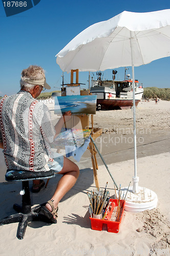 Image of A painter on the beach.