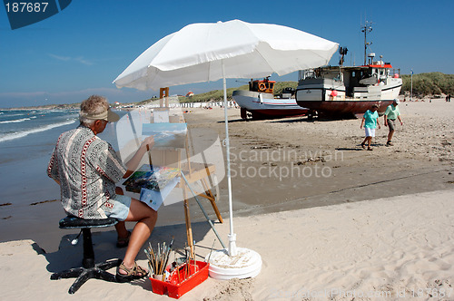 Image of A painter on the beach.