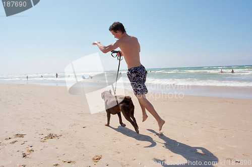 Image of Dog and boy running.