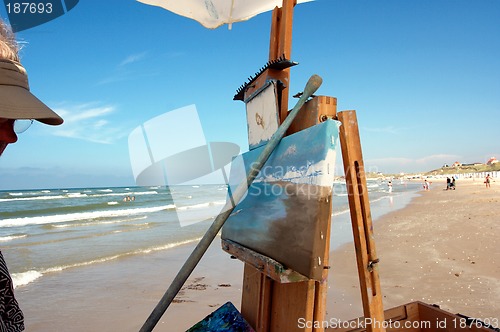 Image of A painter on the beach.