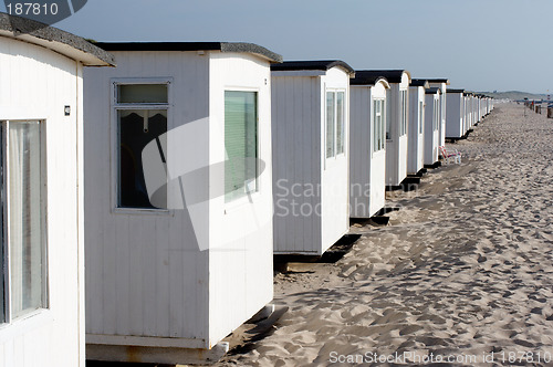 Image of Multiple danish beach houses.