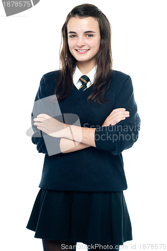 Image of Pretty smiling teenager looking at you confidently