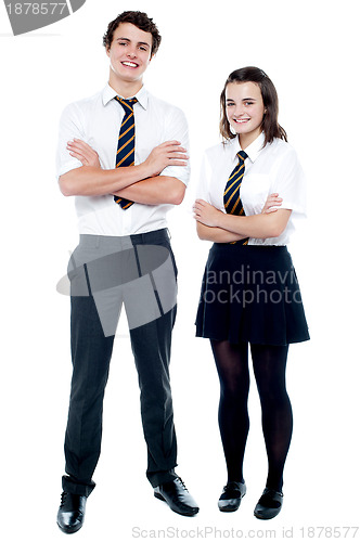 Image of Students in uniform posing with arms crossed