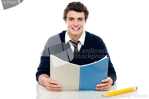 Image of Studious boy preparing for half yearly exams