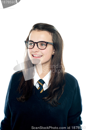 Image of Portrait of smiling young schoolgirl looking away