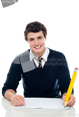 Image of Confident student writing down notes