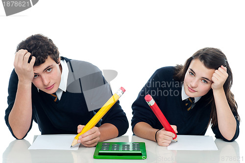 Image of Confused students holding their heads during examination