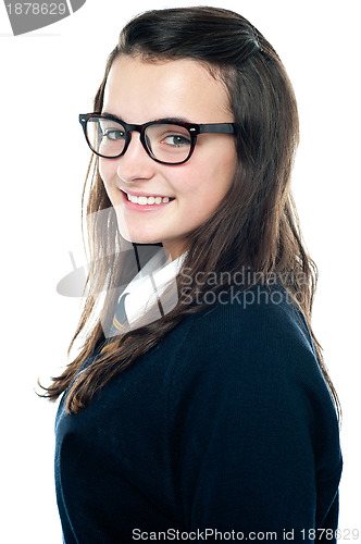 Image of Side view of an adorable teenager wearing spectacles