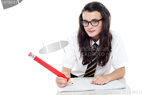 Image of Snap shot of calm and relaxed young schoolgirl