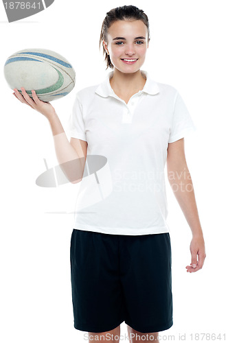 Image of Lovely isolated caucasian teenager with a football