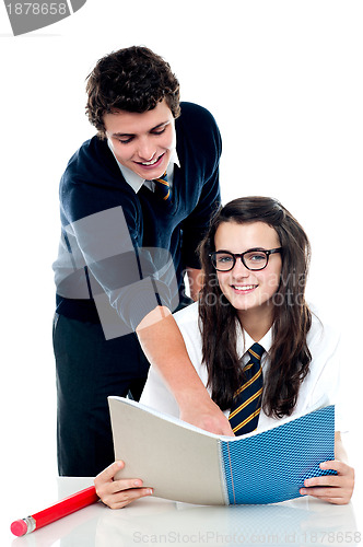 Image of Young boy helping his friend and guiding