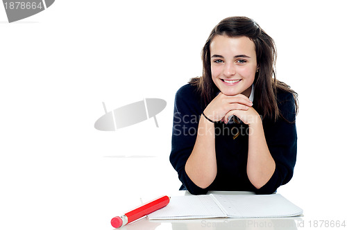 Image of Attractive confident young schoolgirl posing