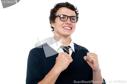 Image of Cheerful youngster celebrating his success