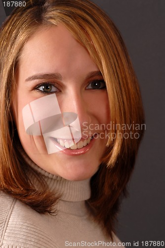 Image of Full face view of a smiling attractive young woman