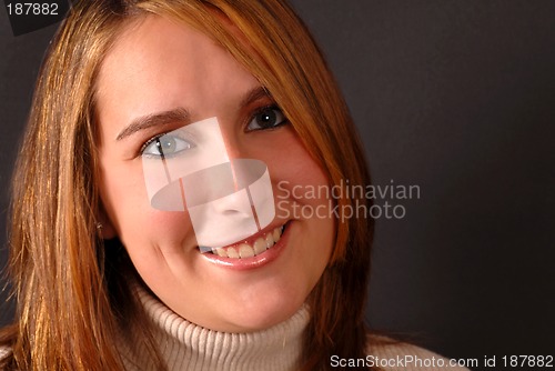 Image of Full face view of an attractive happy young woman