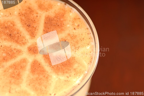 Image of Overhead view of glass of eggnog with nutmeg