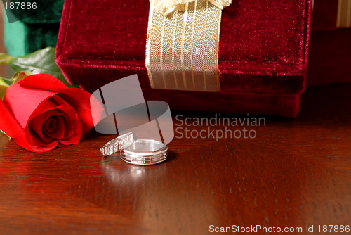 Image of Wedding rings with Christmas gifts and a rose