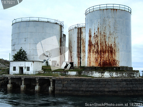Image of Old huge rusty oil tanks