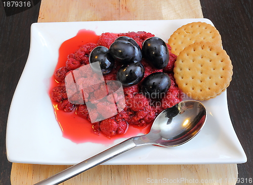 Image of raspberry with grapes and biscuits
