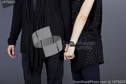 Image of Couple holding hands