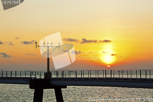 Image of Sunset at airport runway lights in Hong Kong