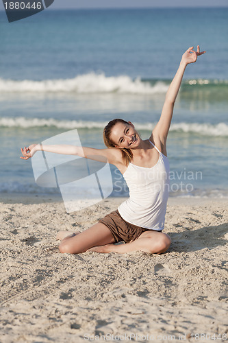 Image of Woman with bikini in the sea jumping portrait