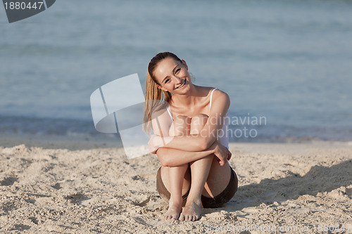 Image of Woman with bikini in the sea jumping landscape