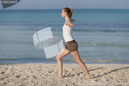 Image of Woman doing yoga on the beach Sports Landscape