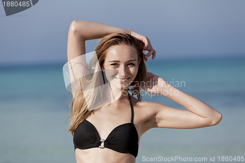 Image of Young woman with bikini on the beach, laughing Portrait Landscap