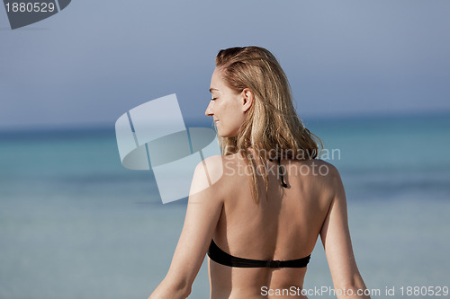 Image of Young woman with bikini on the beach, laughing Portrait Landscap