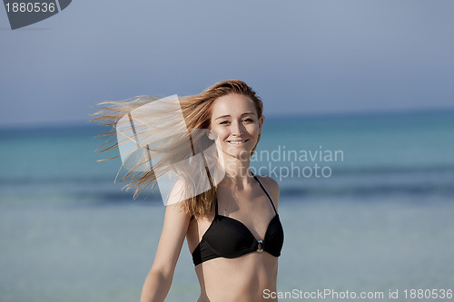 Image of Young woman with bikini on the beach, laughing Portrait Landscap