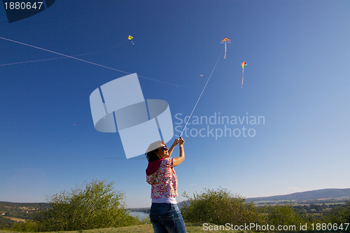 Image of Girl with colorful kites