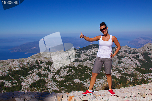 Image of Smiling girl on hilltop