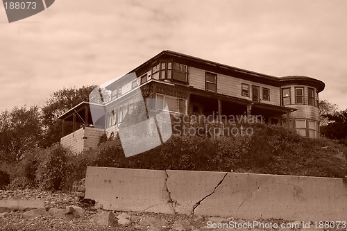 Image of old abandoned beach house sepia