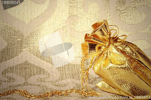 Image of card, sack with gold jewelry