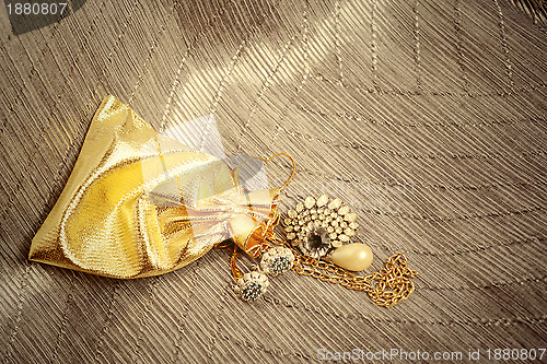 Image of gold sack with vintage jewelry