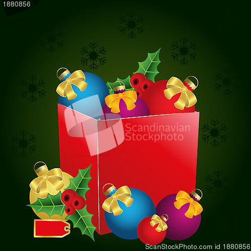 Image of christmas gift box with price tag, bows and balls