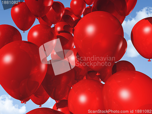 Image of red balloons on a blue sky