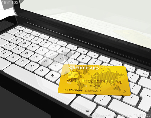 Image of gold credit card on laptop