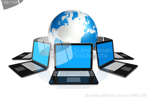 Image of Laptop computers around a world globe