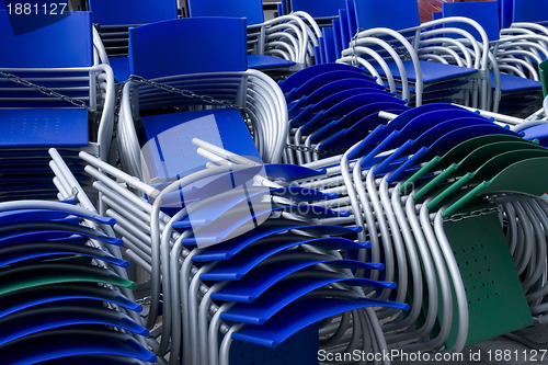 Image of piled chairs outdoor