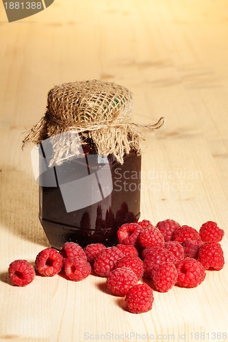 Image of jelly jar on wooden table