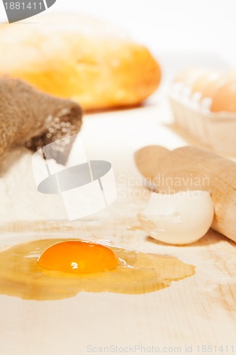 Image of flour, egg on kitchen table