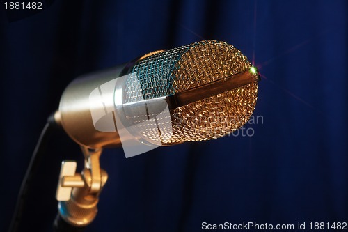 Image of golden  microphone close up