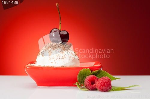 Image of tasty ice cream ball with berries