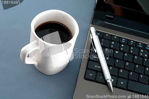 Image of Notebook, pen and a big coffee