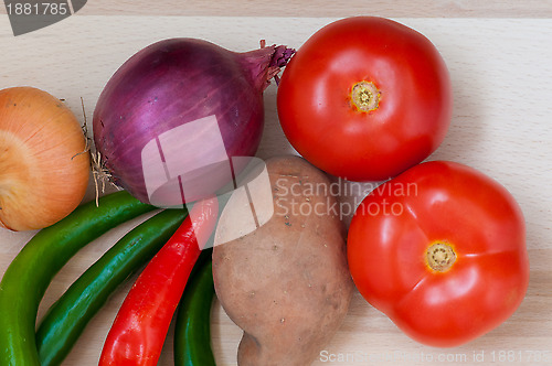 Image of Tomatoes,green and red pepper, onion, potato